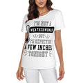 Woman wearing a naughty graphic t-shirt with saying, "I'm not a weatherwoman, but I'm expecting a few inches tonight." Lady dressed in all white pants and t-shirt with black lettering. Naughty graphic swinger tee.