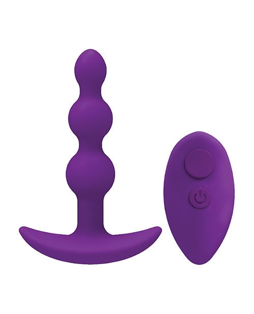 Purple silicone butt plug with remote control on a white background
