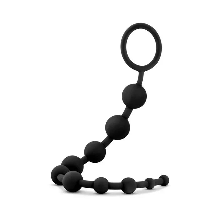 Black silicone teething ring on a white background