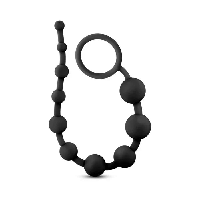 Black silicone teething ring with a keychain ring on a white background