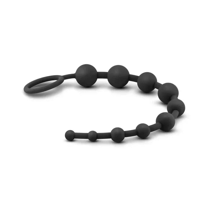 Black silicone teething ring on a white background