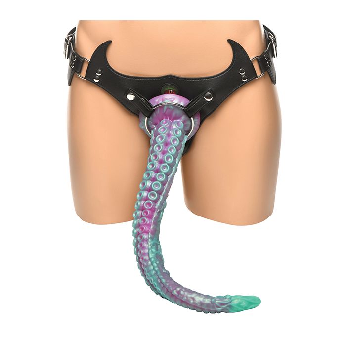 Black leather harness with a colorful octopus tail attachment on a mannequin.