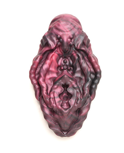 Maroon-colored decorative item on a white background