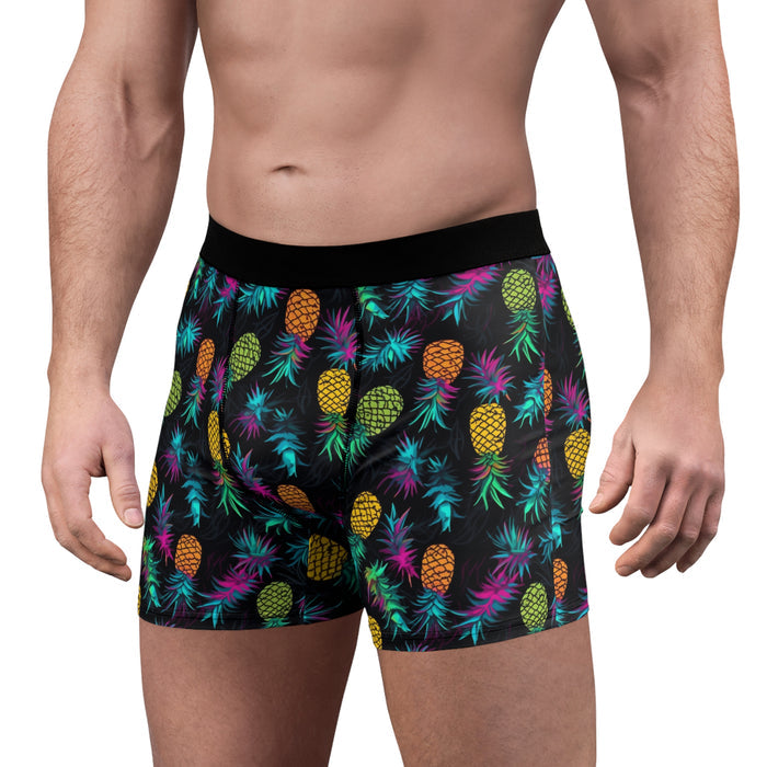 Colorful pineapple-patterned boxer briefs on a white background