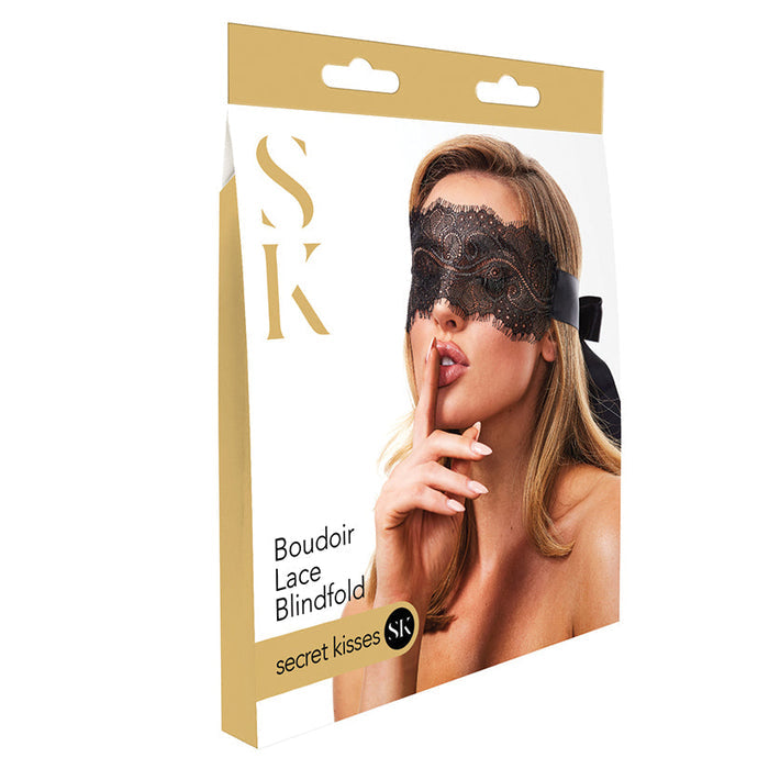 Packaging of a boudoir lace blindfold with a model wearing it on a white background