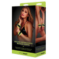 Product packaging for 'whipsmart' deluxe detachable buckle cuffs with a model wearing the product.