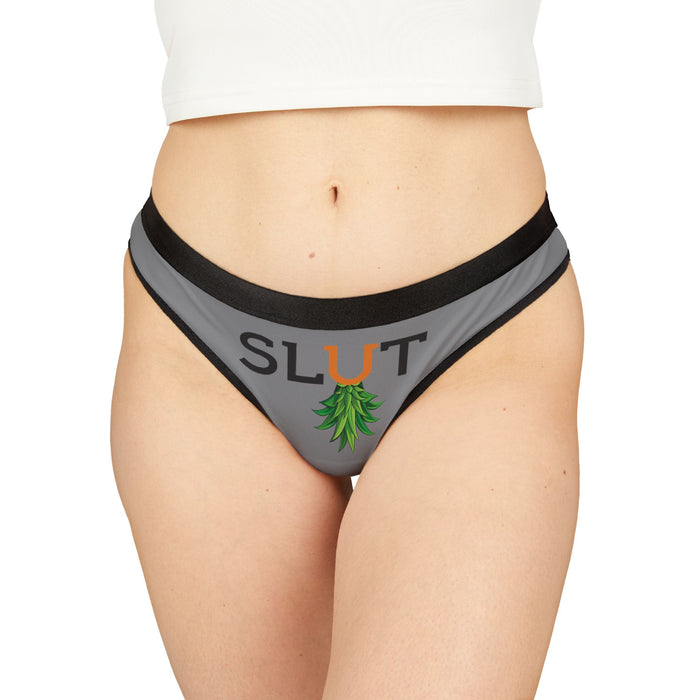 Gray underwear with 'SLUT' printed on it against a white background